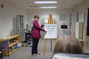 Dr. Pettitt performing an eye exam for a patient with low vision.